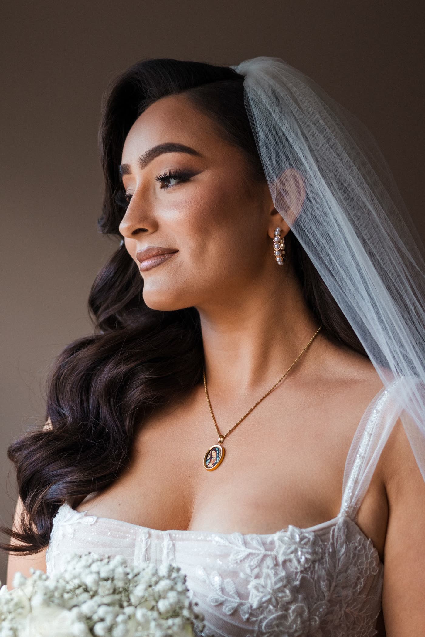 Bride in veil, soft window-light portrait
