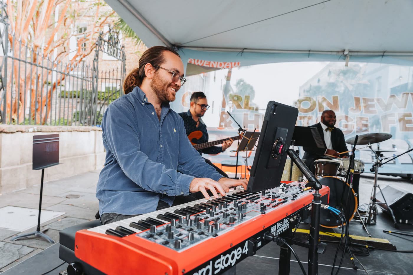 Keyboardist performing at an outdoor festival